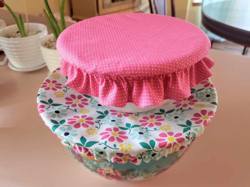 two handmade reversible fabric bowl covers