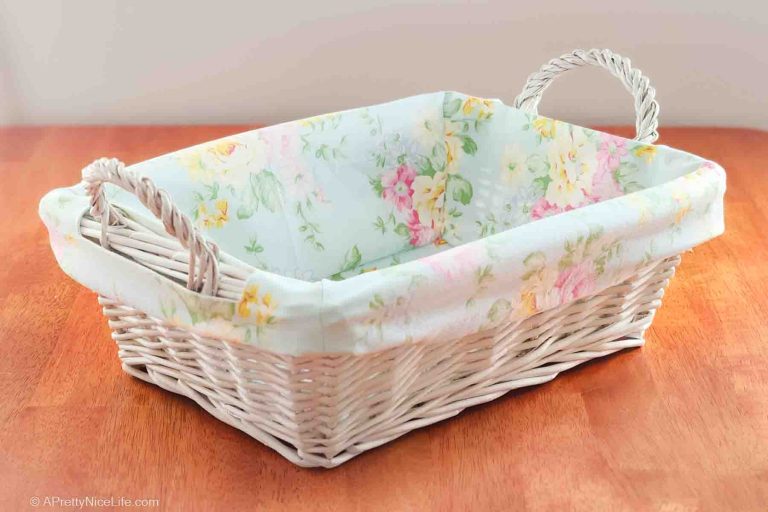 White wicker basket with handles with pretty fabric liner for spring