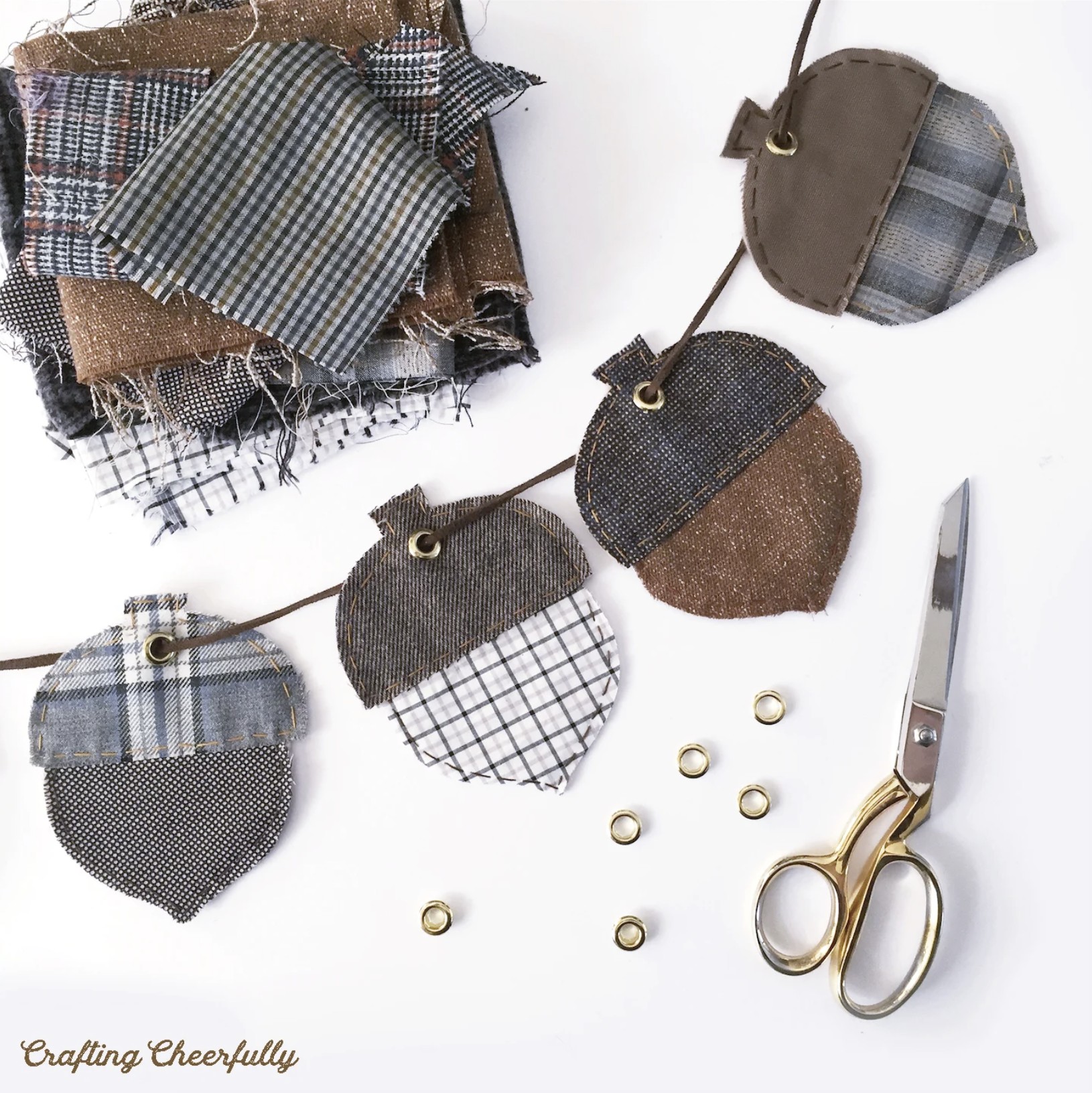 Adorable fall acorn banner made with wool, tweed, plaid, glen check, houndstooth, tartan and herringbone fabrics. Would look cute with leather too!