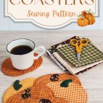 Six quilted fabric pumpkin coasters on a wood table with a coffee cup resting on one. Fall fabric scraps and small scissors are visible in the background. A decorative banner with harvest pumpkin graphics frames the text: "Pumpkin Coasters Sewing Pattern APrettyNiceLife.com"