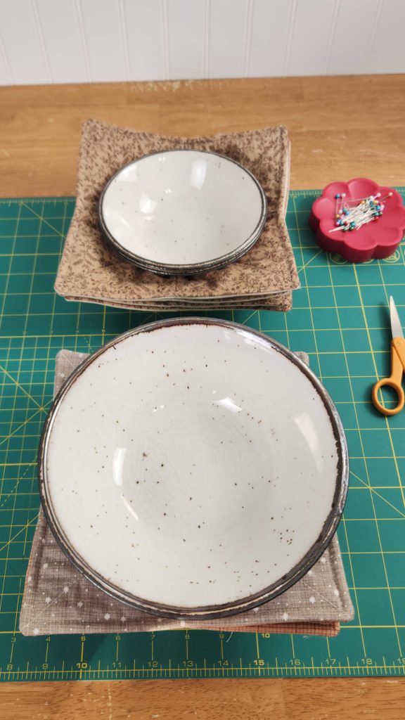 Large bowl and regular size bowl resting in the same size bowl cozy. Great versatile design!