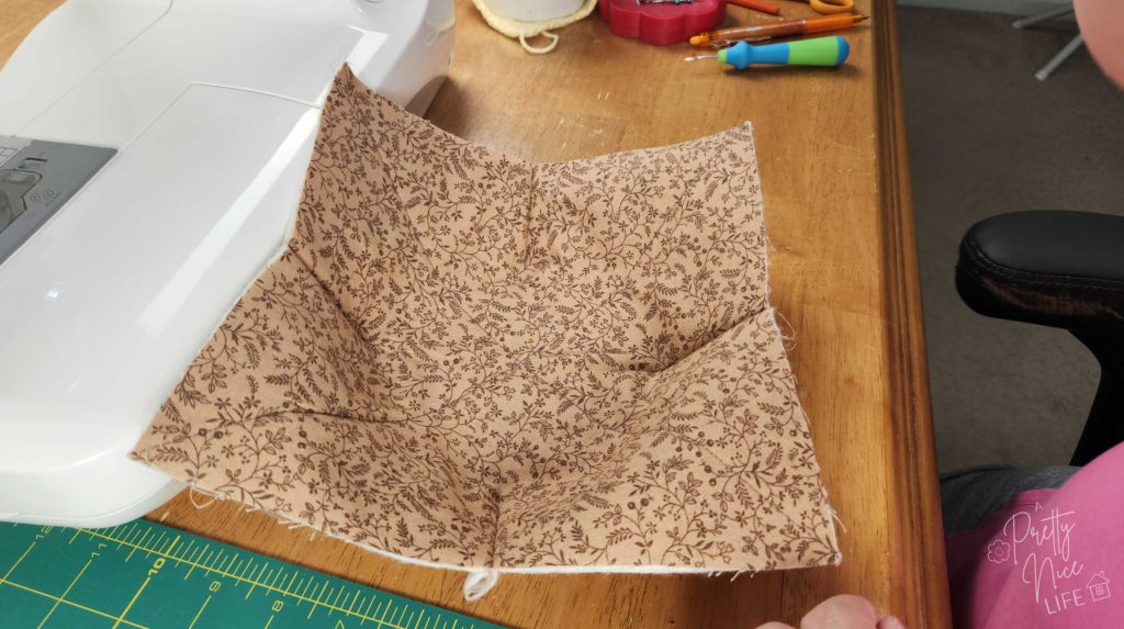after sewing darts, this layer of the cozy begins to take on a bowl shape