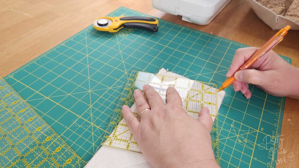 Mark the sides of the bowl cozy where you will sew the darts