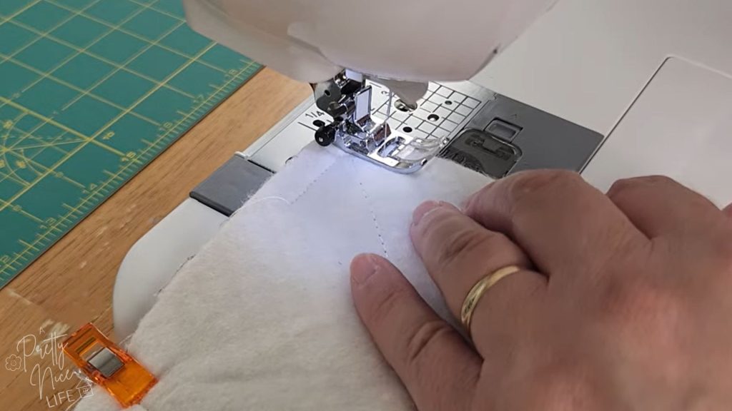 bowl cozy layers on sewing machine, with 3/8" seam allowance all the way around except a 2" opening for turning